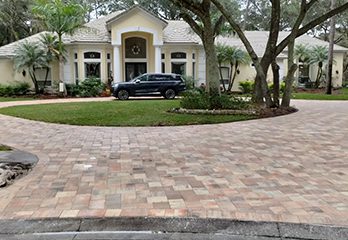 Brick paver circular driveway in front of house Brick paver circular driveway in front of house