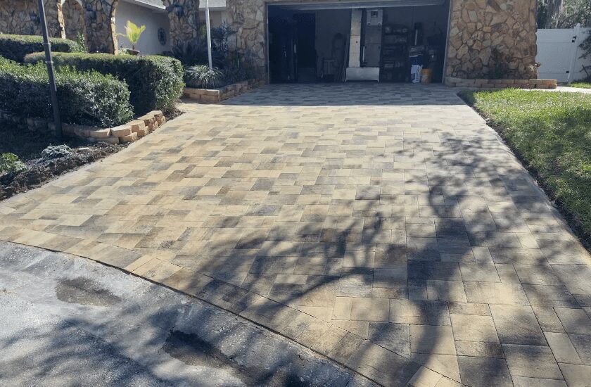 Brick paver driveway in front of garage