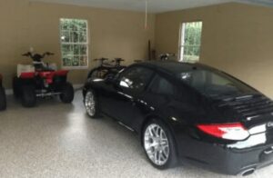 Black Porsche on garage floor