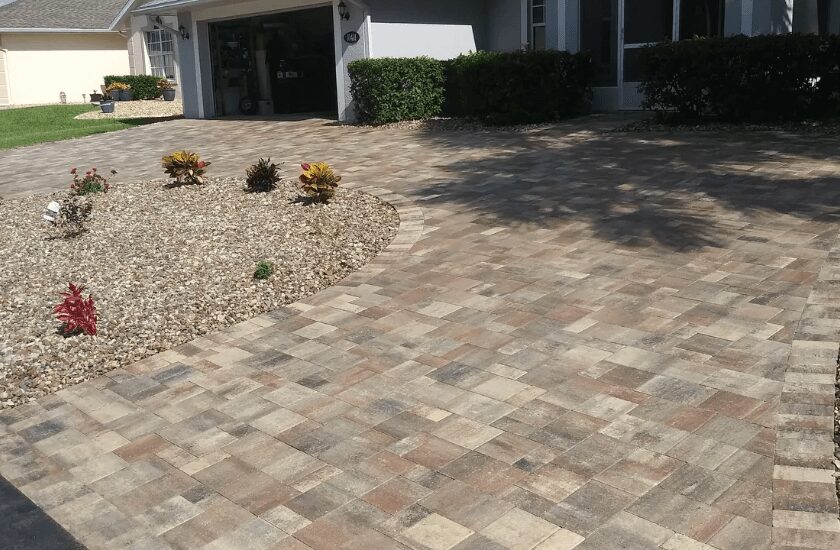 Circular paver driveway in front of house