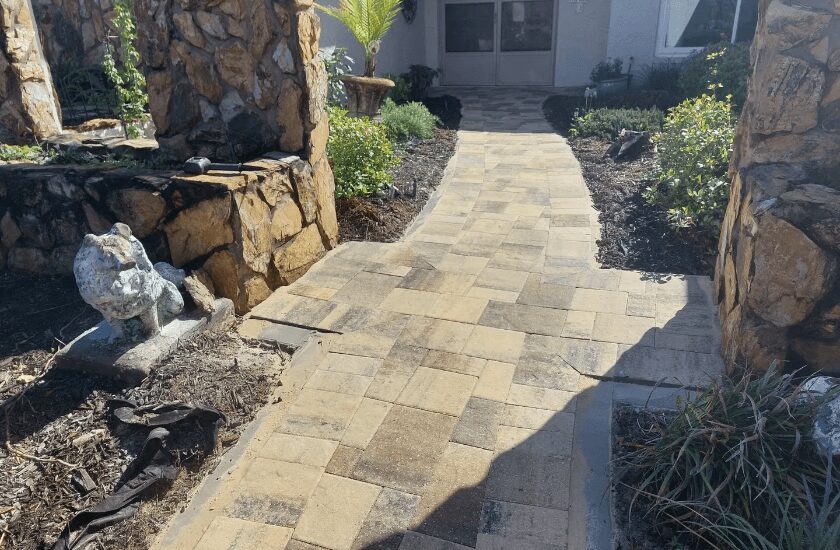 Brick paver walkway in front of house