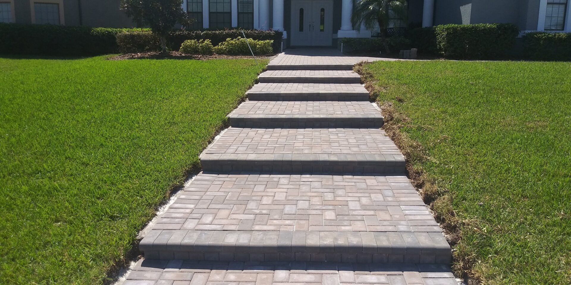 brick paver walkway in front of house