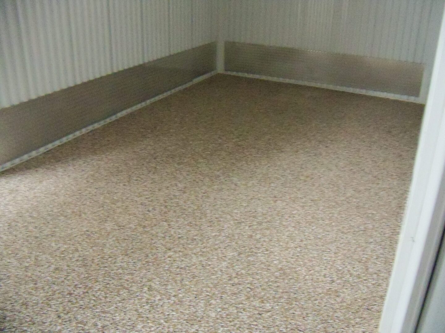 garage floor with brown beige flakes