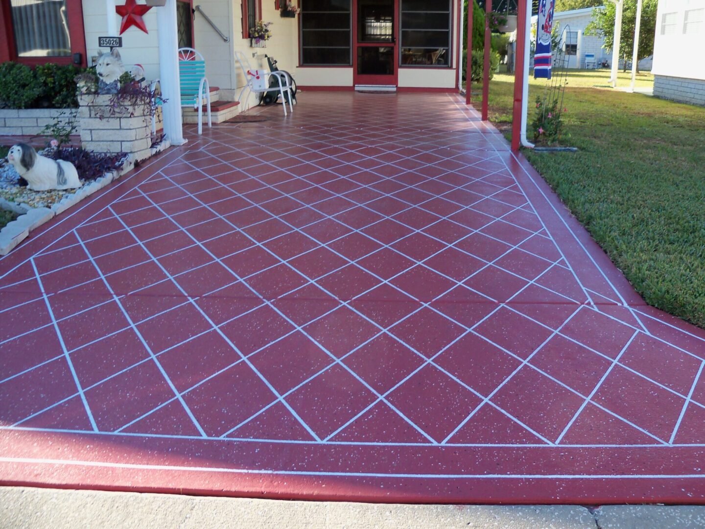 painted driveway red with white design