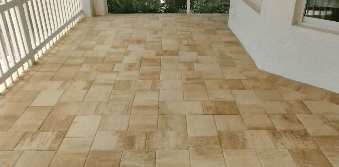 Beautifully installed beige and tan patio pavers by Decorative Driveways in Tampa, showcasing a clean, geometric design perfect for outdoor spaces.