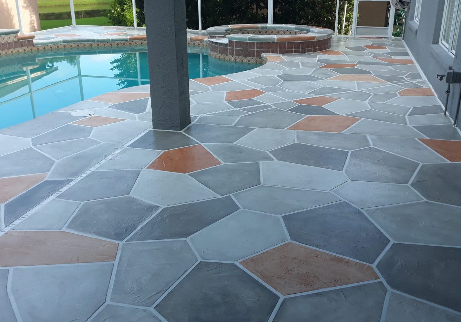 gray and orange stimulated stone pool deck